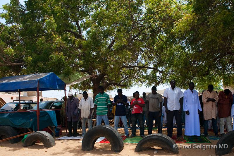 20090529_141255 D3 P1 P1.jpg - People lined up on the side of road for Friday prayer